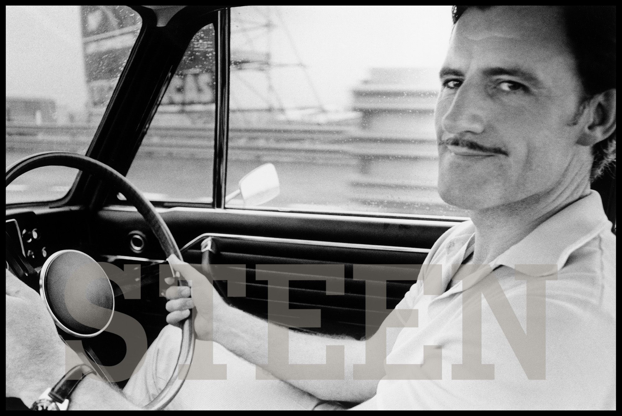 A fine art photograph of British Racing Driver Graham Hill by Celebrity Photographer David Steen. Exclusive limited edition fine art prints.