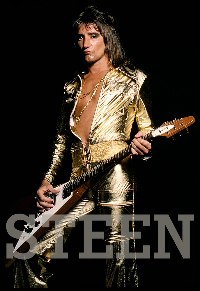 exclusive photograph of rod stewart wearing a gold all in one jumpsuit whilst playing an electric guitar by british photographer david steen